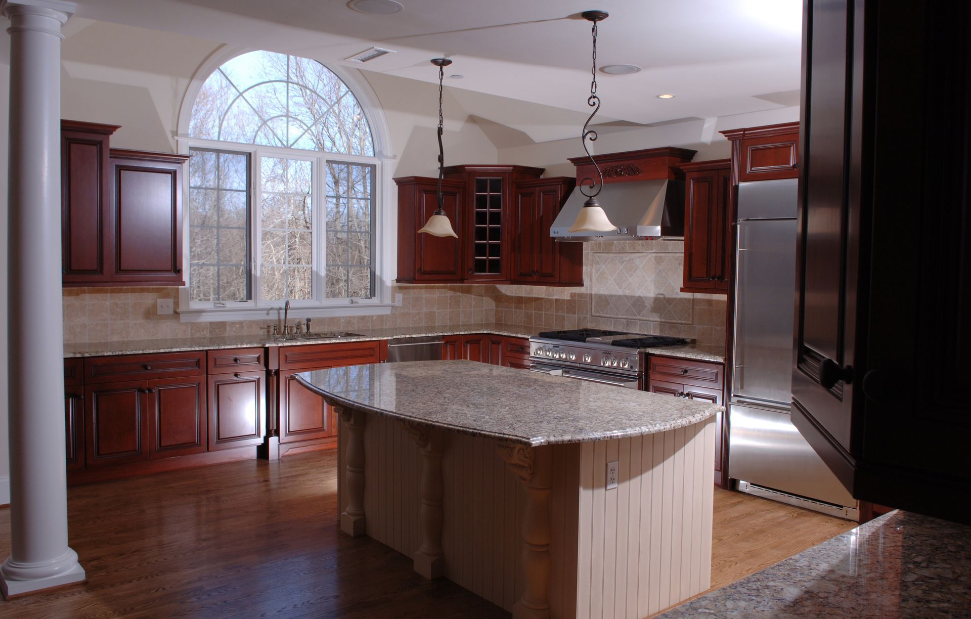 A kitchen with stainless steel appliances and granite counter tops