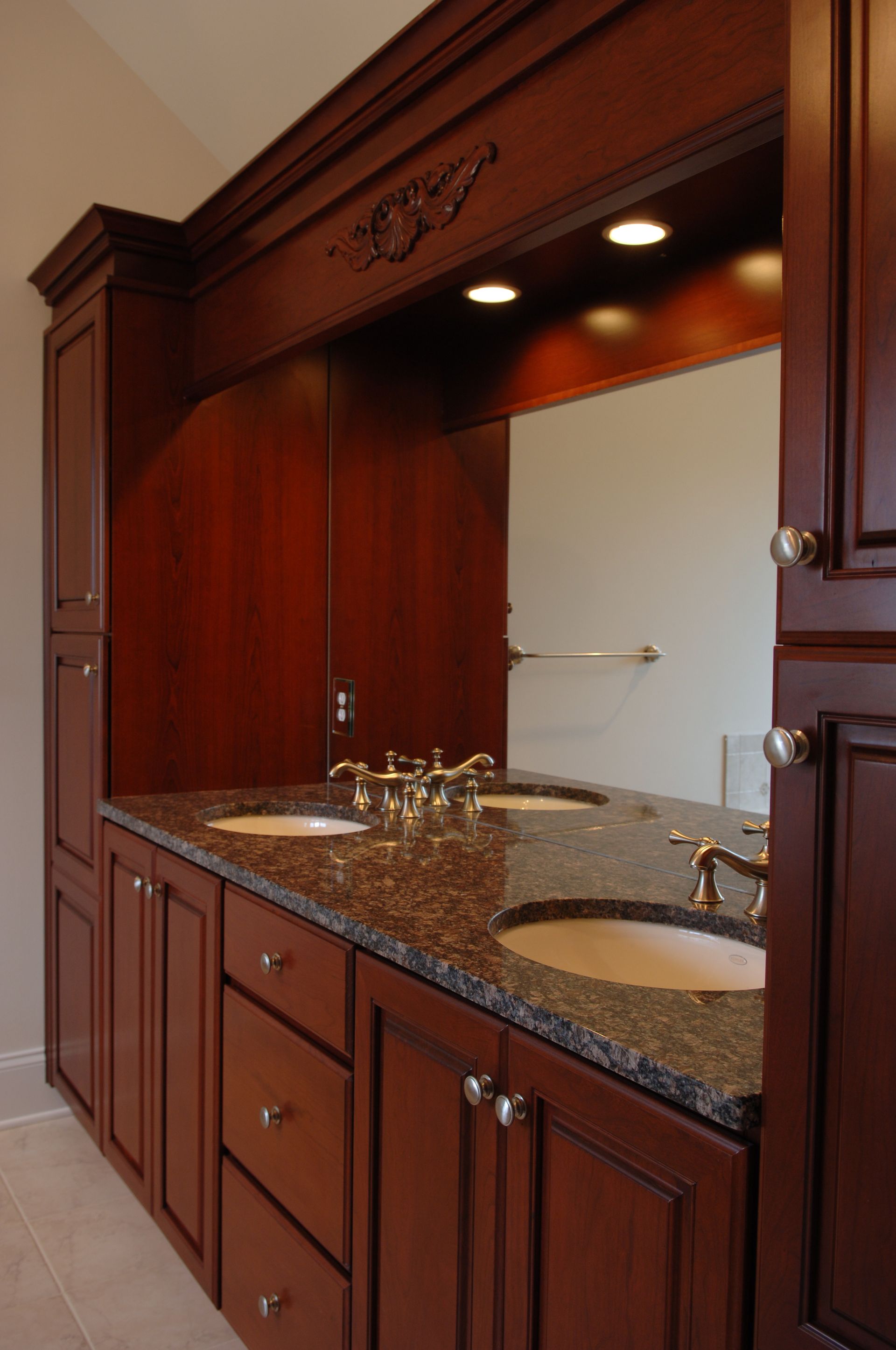 A bathroom with two sinks and a large mirror