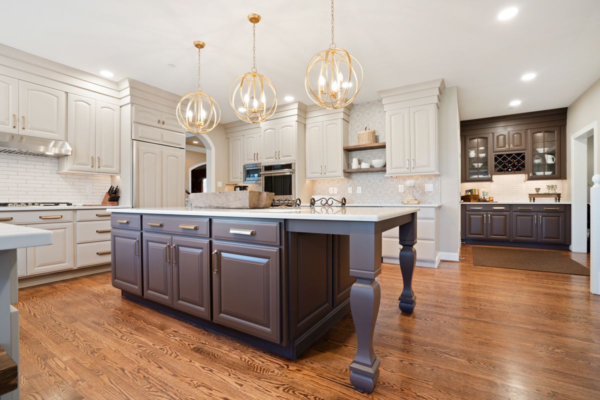 There is a large island in the middle of the kitchen.