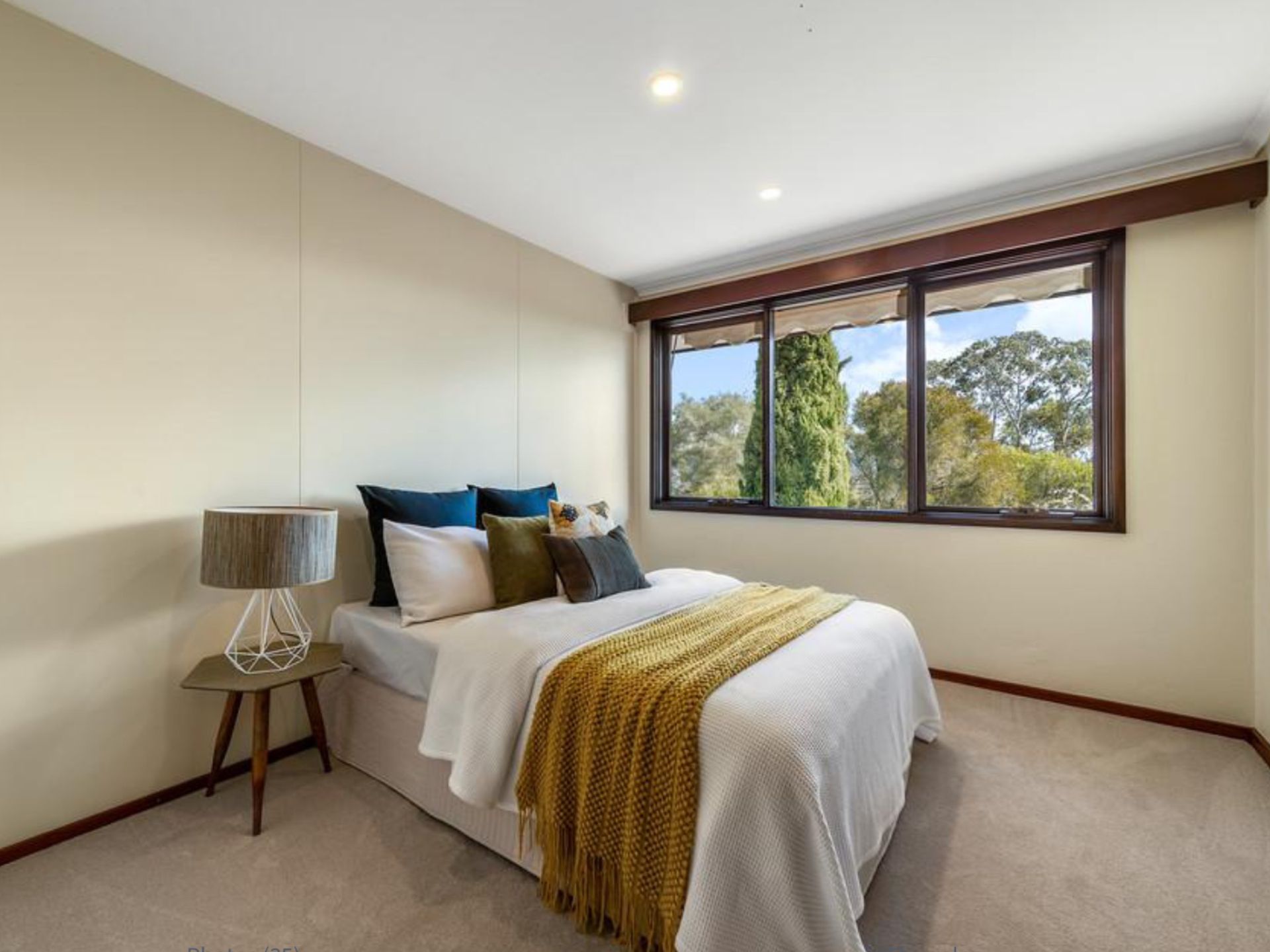 A Bedroom with Beige Walls, Large Windows and a Bed - A&J Painting In Gungahlin, NT