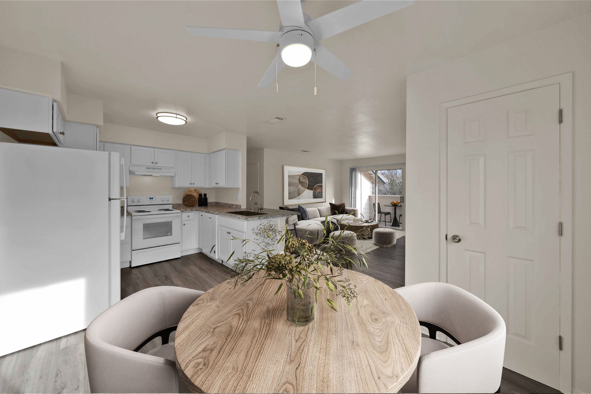 2 Bedroom, 2 Bathroom - Dining room with view into kitchen and living room.