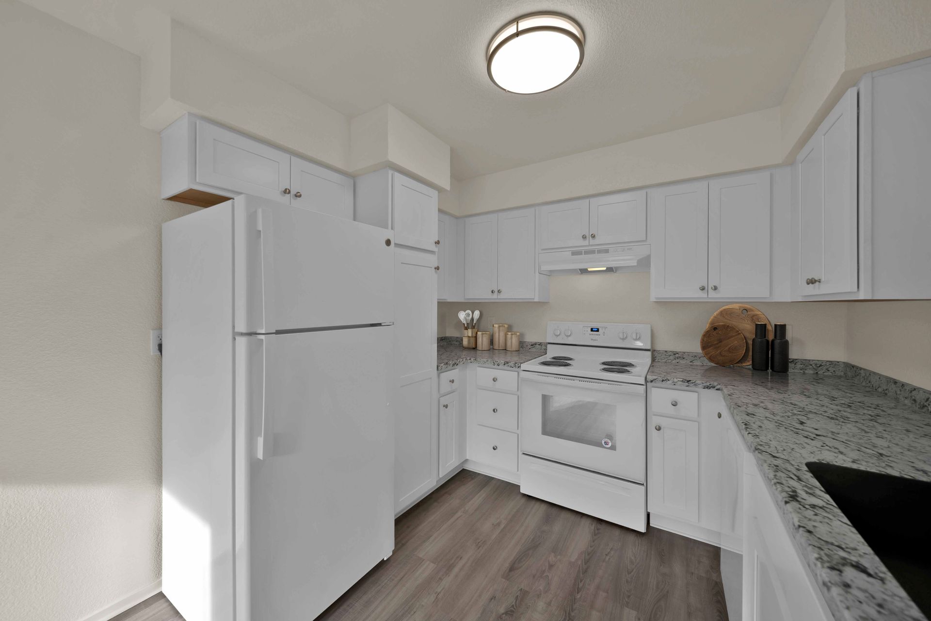 2 Bedroom, 2 Bathroom - Fully equipped kitchen with white appliances and quartz countertops.