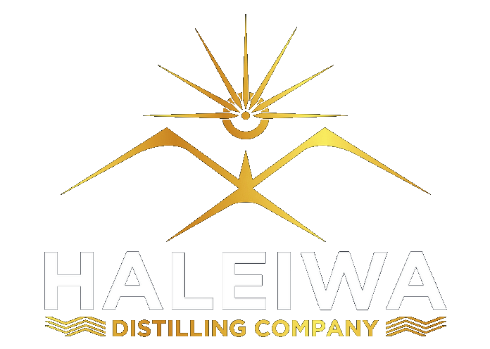 The haleiwa distilling company logo is a gold and white logo with a sun and mountains.