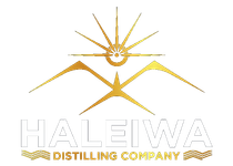 The haleiwa distilling company logo is a gold and white logo with a sun and mountains.