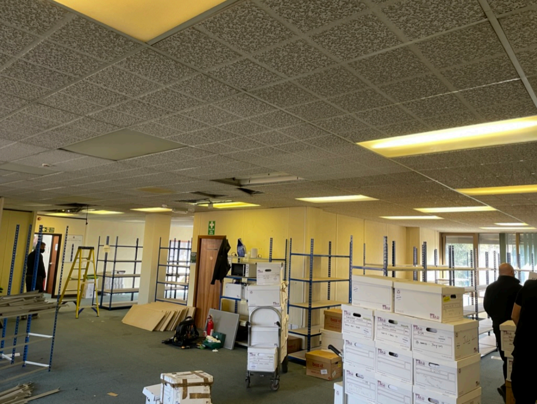 Office refit project with ceiling work, materials, and equipment inside a commercial workspace.