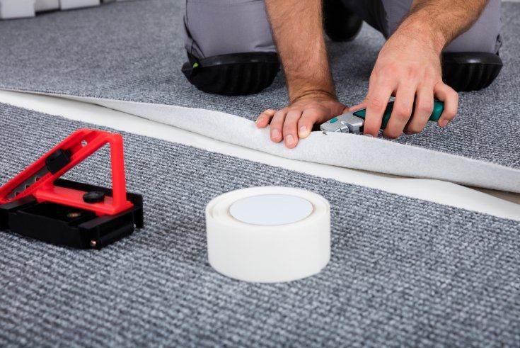 Man Fixing the Carpet
