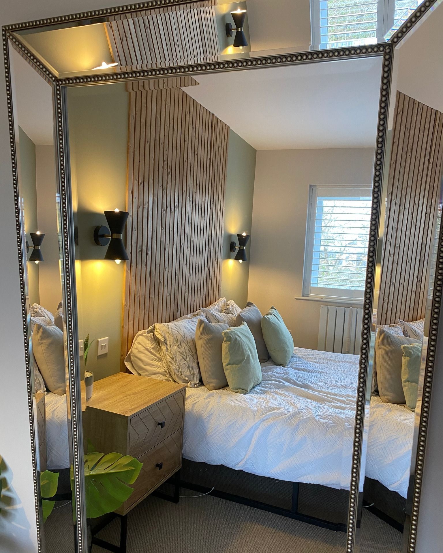 bedroom bedside lights reflected in mirror
