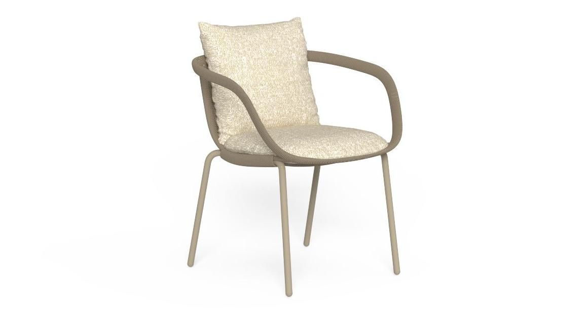 Tan outdoor chair with cushion and curved arms.