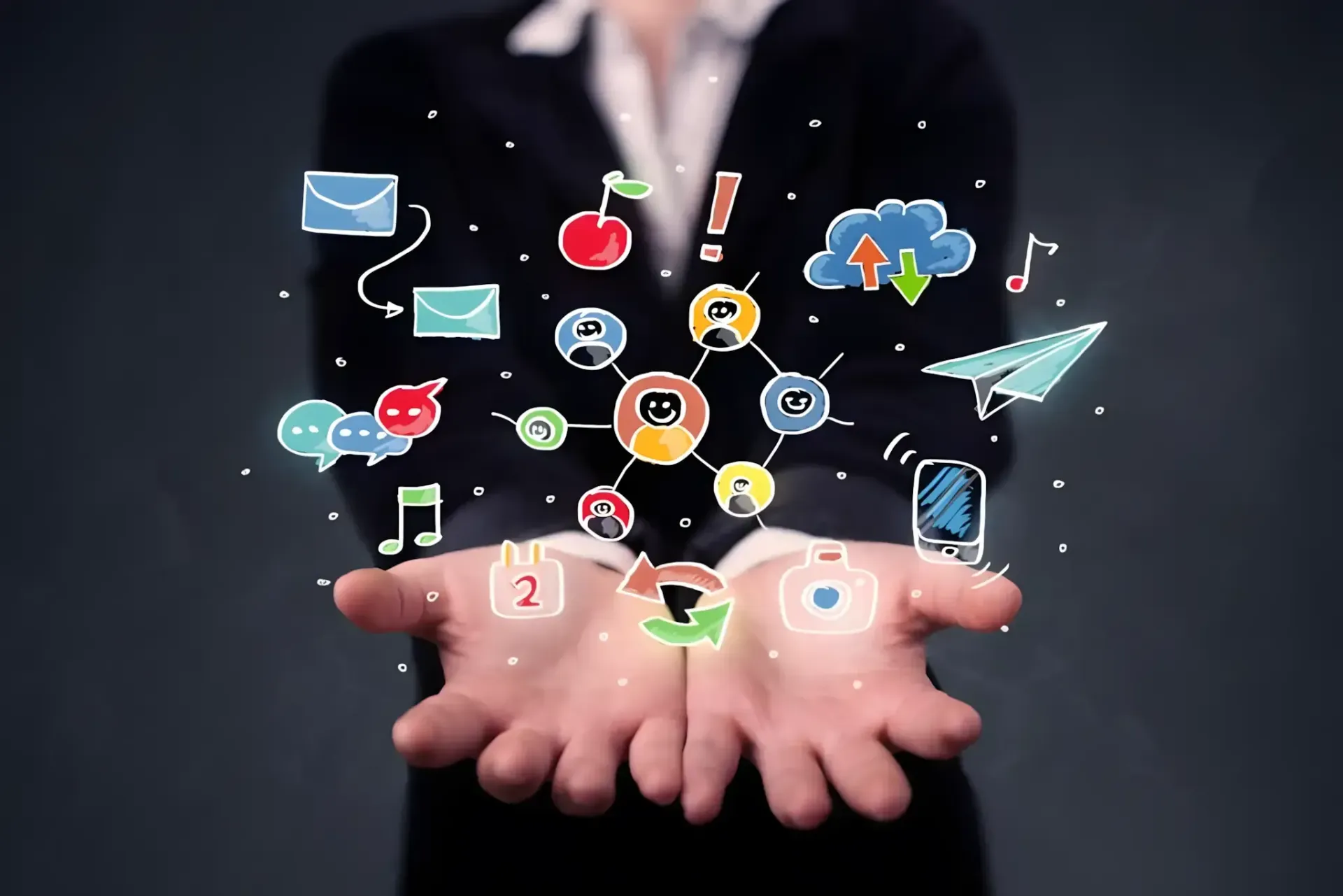 Hands cupped beneath floating colorful social media and communication icons on a dark background