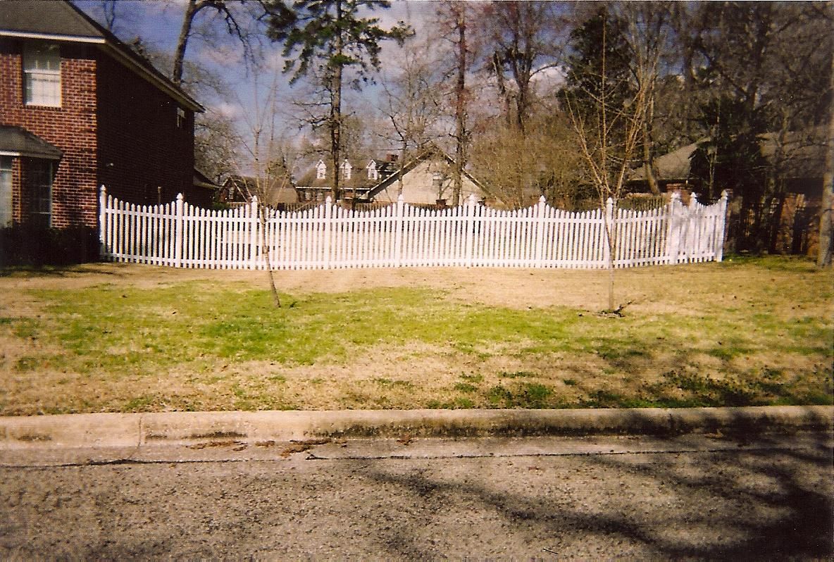 White vinyl picket fence