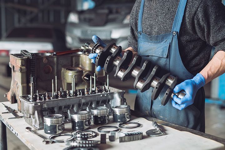 Master collects a rebuilt motor for the car..
