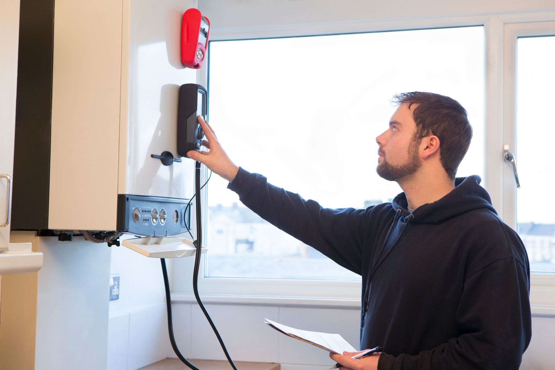 Engineer Servicing Central Heating Boiler — Woodland, WA — MJT Plumbing Inc. Engineer Servicing Central Heating Boiler — Woodland, WA — MJT Plumbing Inc.