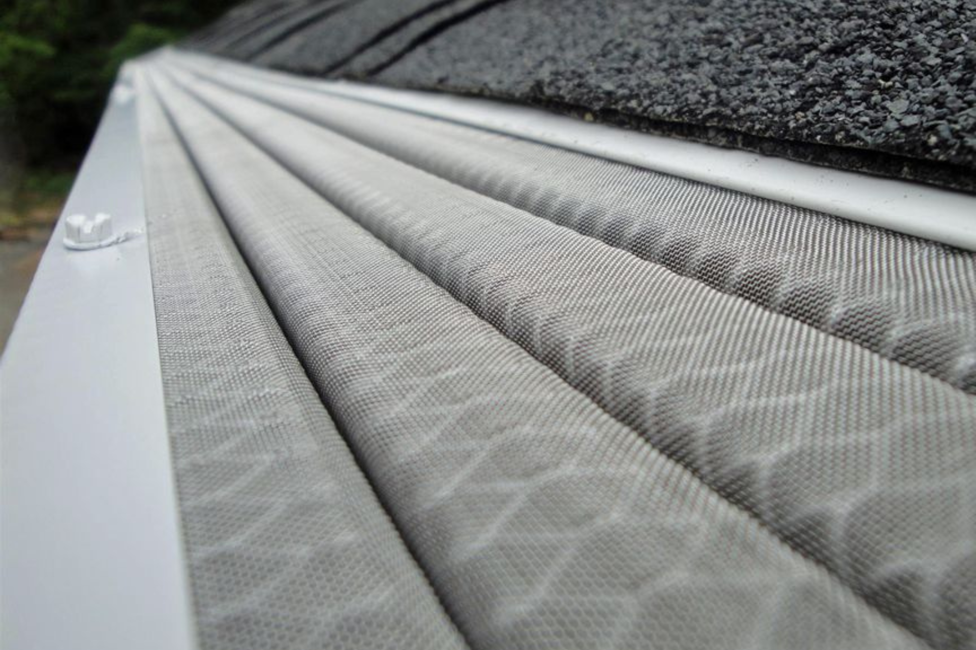 a close up of a gutter on a roof.