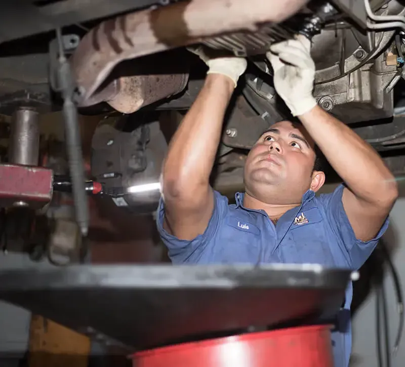 Mechanic Checking Exhaust System in Raleigh, NC - MJ Brothers Auto & Truck Repair