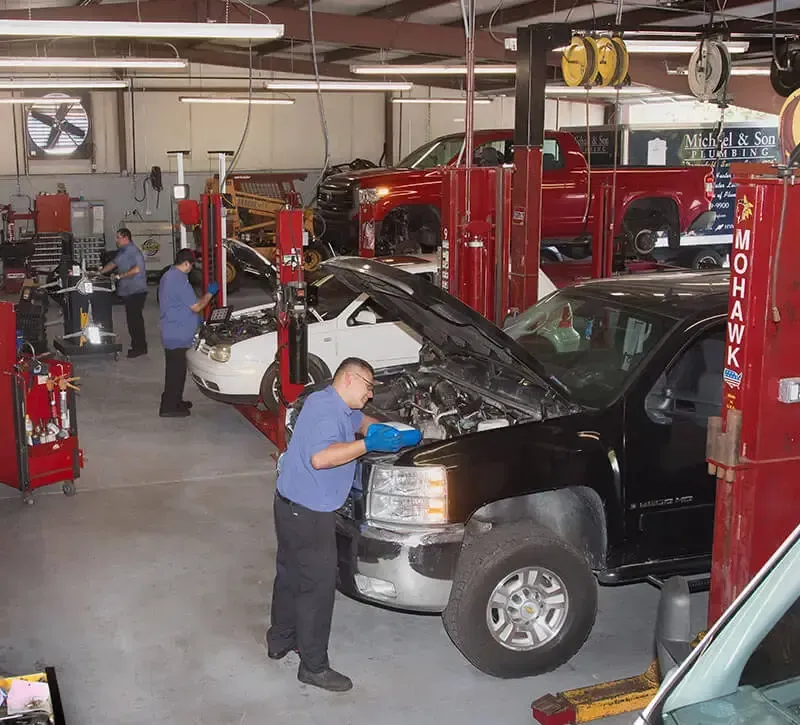 Mechanic Checking Lights in Raleigh, NC - MJ Brothers Auto & Truck Repair