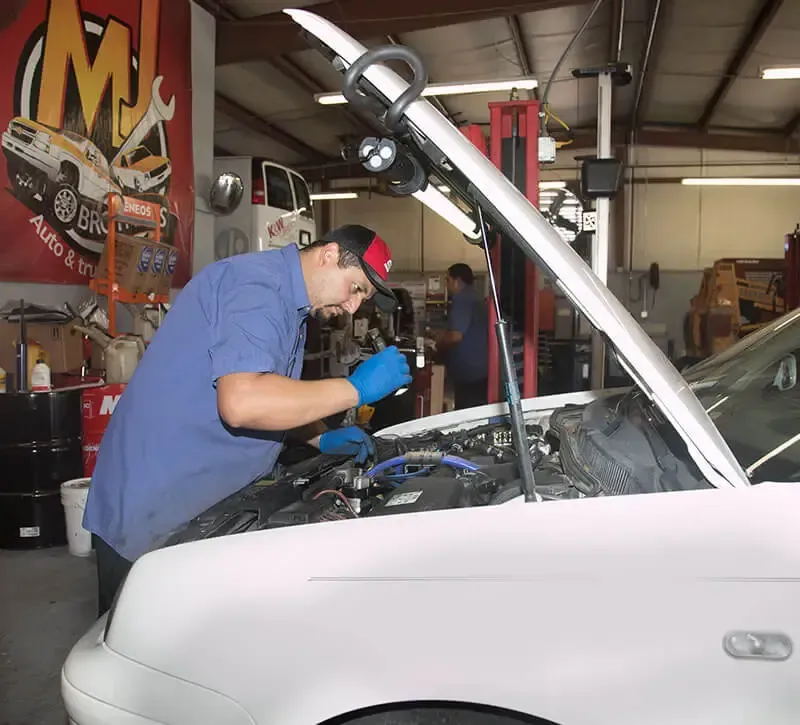 Our Mechanic Working on Vehicle Engine in Raleigh, NC - MJ Brothers Auto & Truck Repair