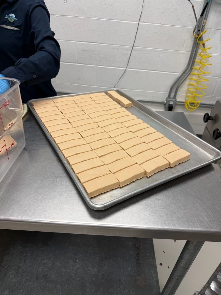 Power Puck Honey Bars on a tray before baking
