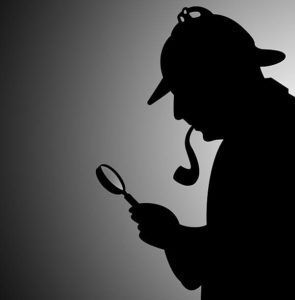 A silhouette of a detective looking through a magnifying glass.
