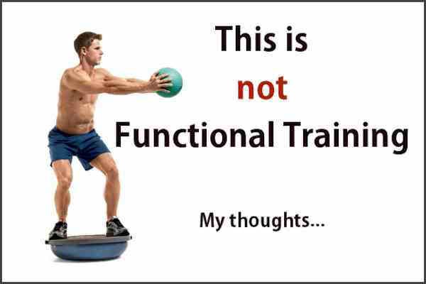 A man is standing on a balance board holding a ball.