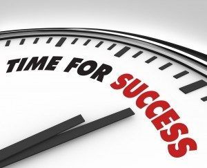 A clock with the words time for success on it