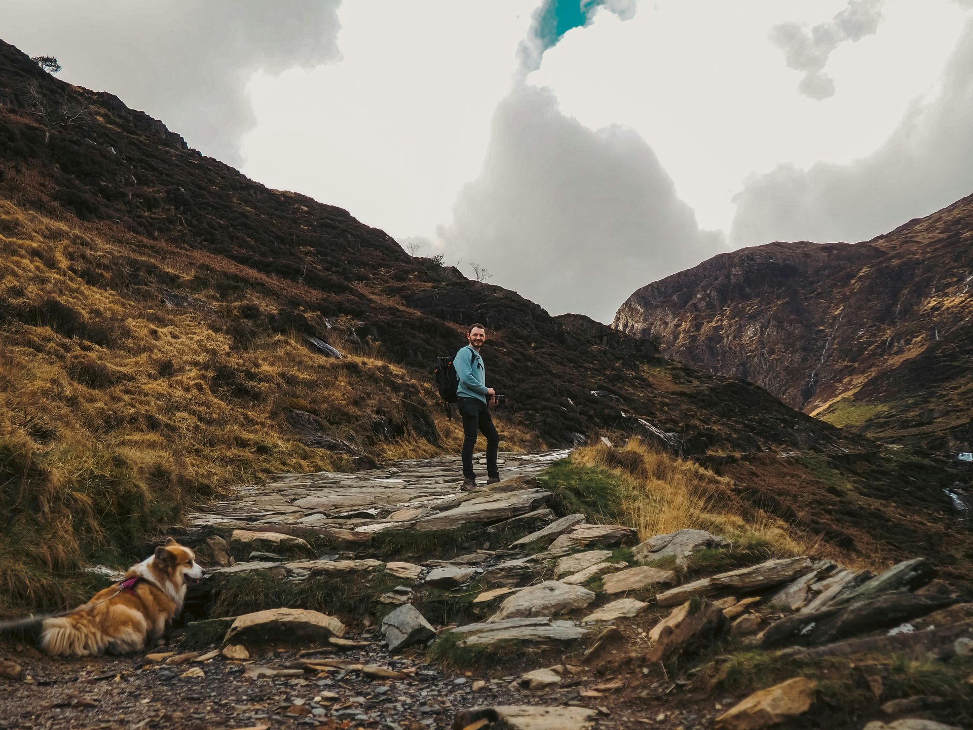 Person walking up mountain trail