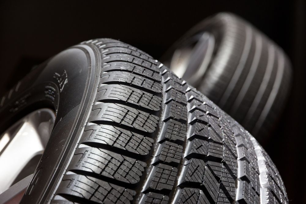 Close-Up of Two Car Tires With Deep Tread — Envy Automotive in Toukley, NSW