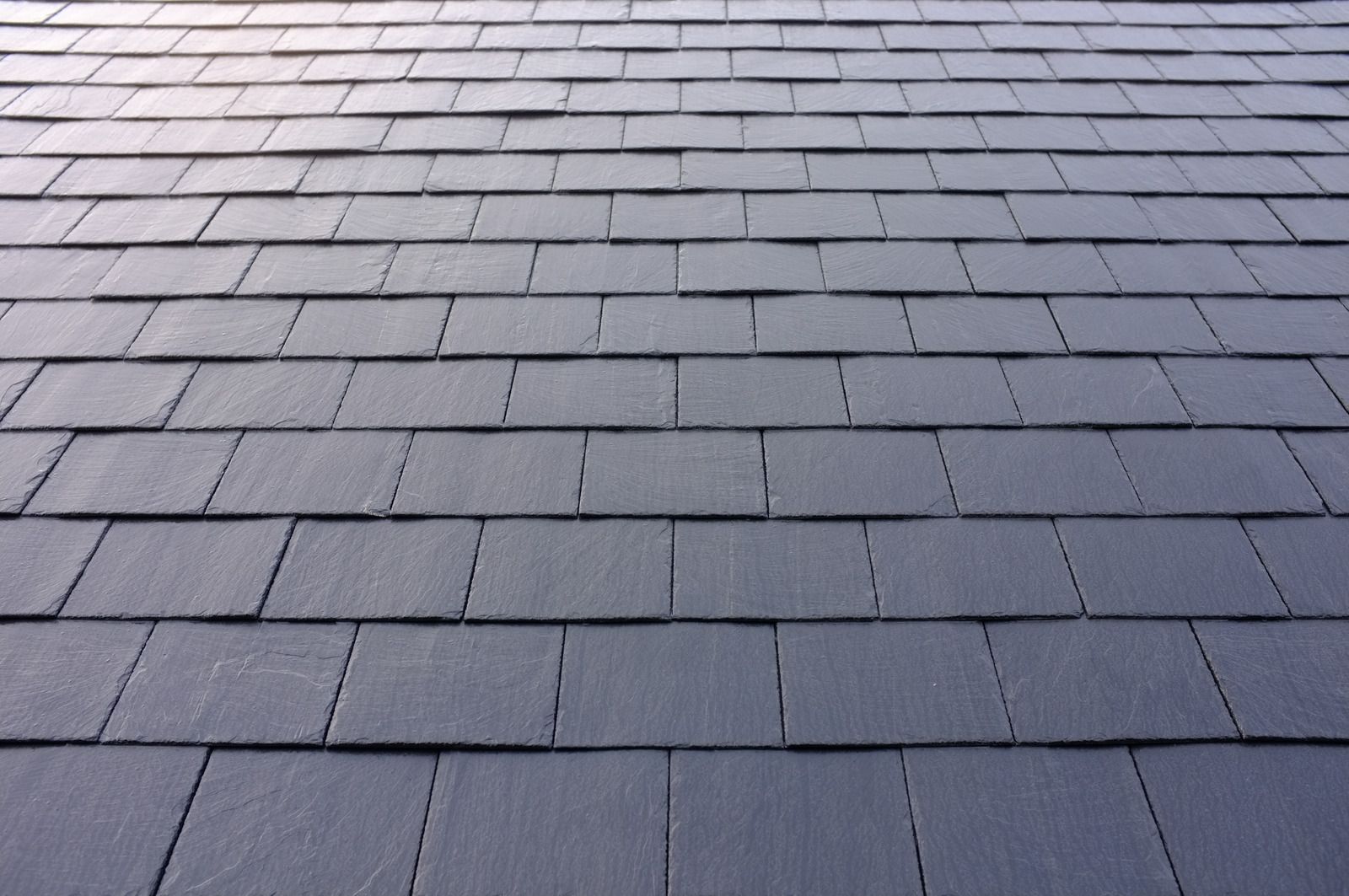 A close up of a roof made of slate tiles