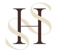 A letter h with a ribbon around it on a white background
