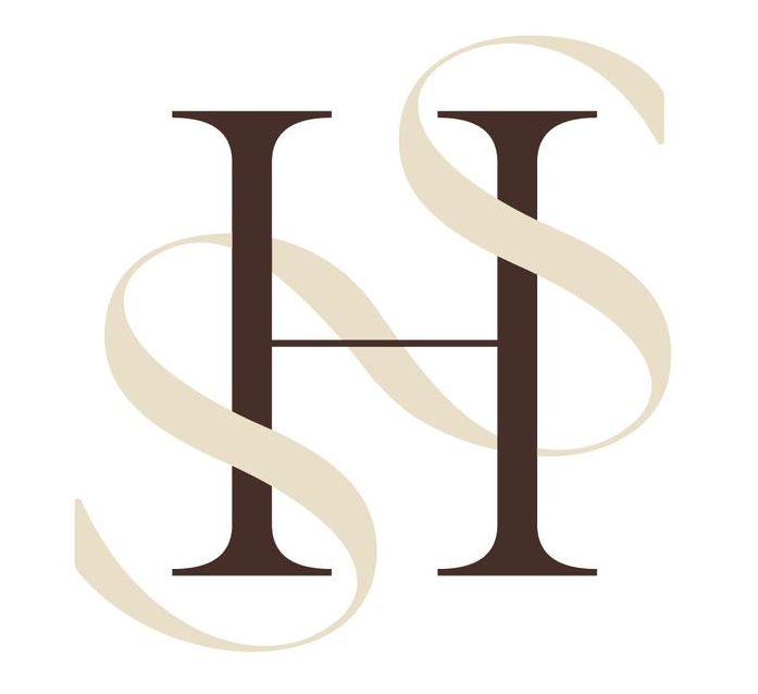 A letter h with a ribbon around it on a white background
