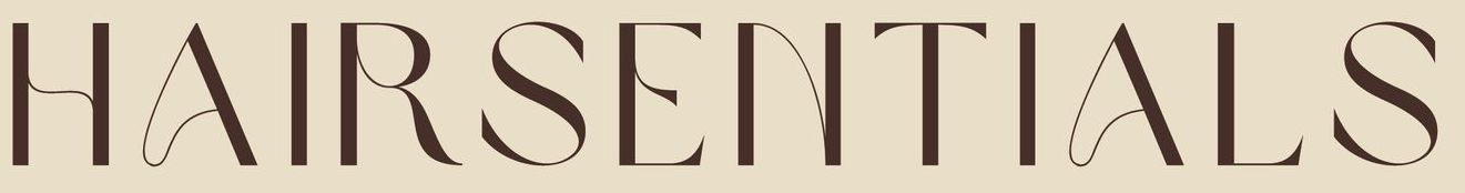 A close up of the word hairessentials on a beige background.