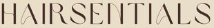 A close up of the word hairessentials on a beige background.