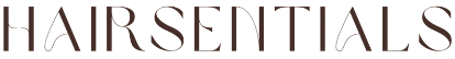 A close up of the word hairsentials on a white background.