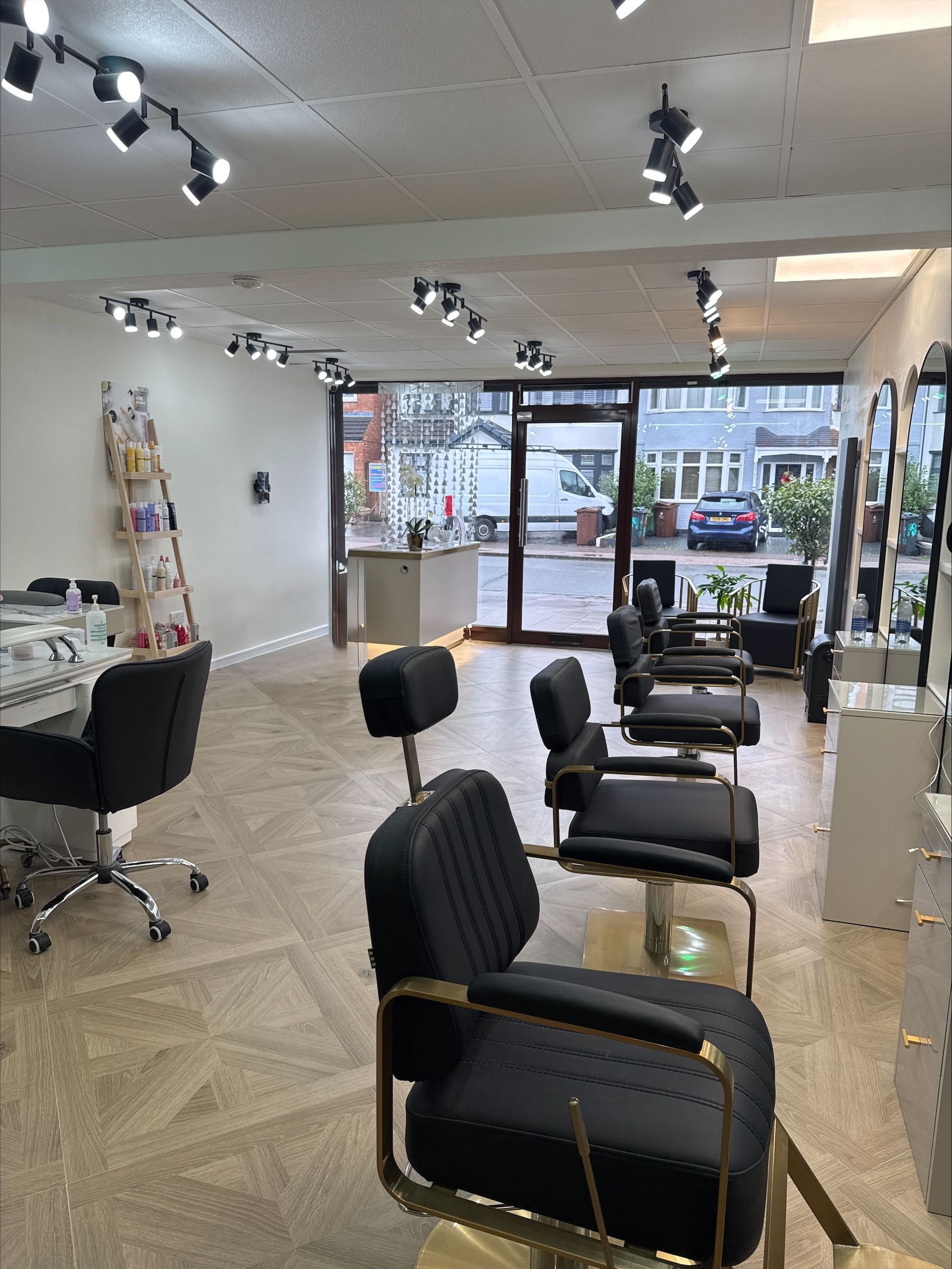 A hair salon with a lot of chairs and mirrors.