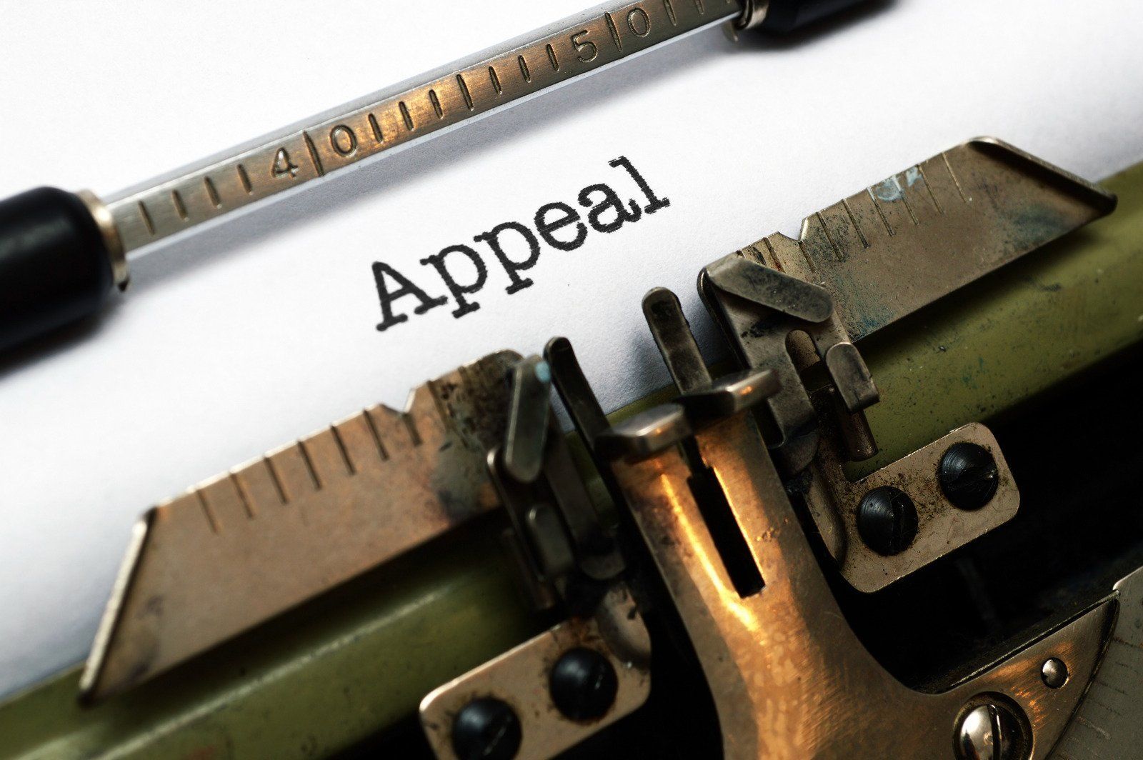 A typewriter with the word appeal written on it