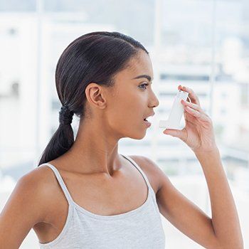 Woman With Inhaler — Bluefield, VA — Allergy & Asthma Center of Bluefield Woman With Inhaler — Bluefield, VA — Allergy & Asthma Center of Bluefield