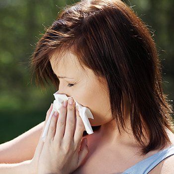 Woman Blowing Her Nose — Bluefield, VA — Allergy & Asthma Center of Bluefield Woman Blowing Her Nose — Bluefield, VA — Allergy & Asthma Center of Bluefield