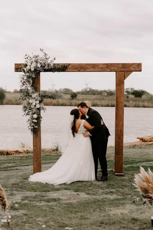 bride and groom holding hands