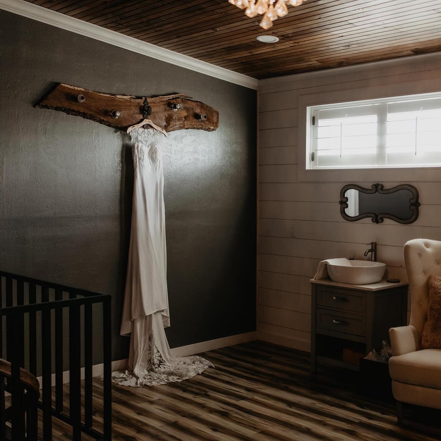 wedding dress hanging on wall