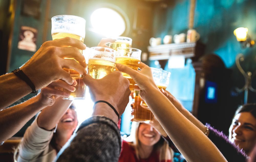 Group of Happy Friends Drinking and Toasting Beer — Pub in Stuart Park, NT