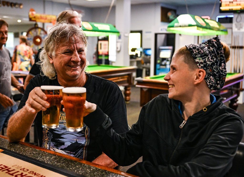 Two Joyous Individuals Enjoying Beer — Pub in Stuart Park, NT 