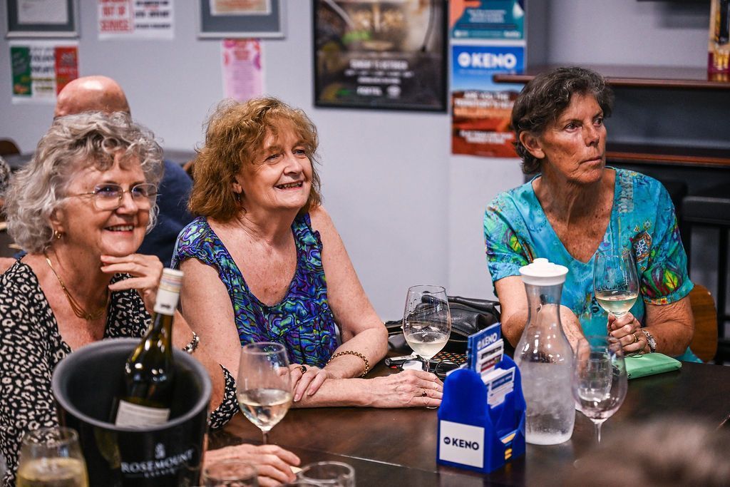 Three Women Sit At A Table With A Keno Sign In Front Of Them — Pub in Stuart Park, NT 