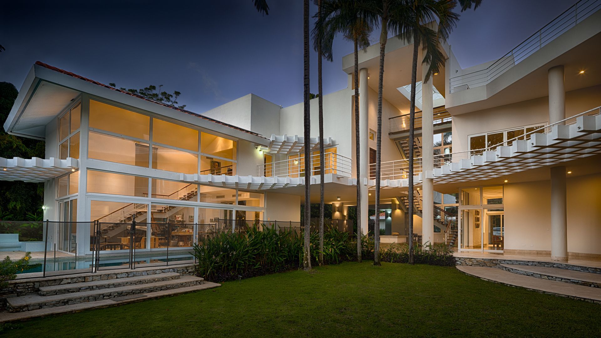 Professional architectural photography of a modern luxury villa with open-concept design in Punta Barco Resort.
