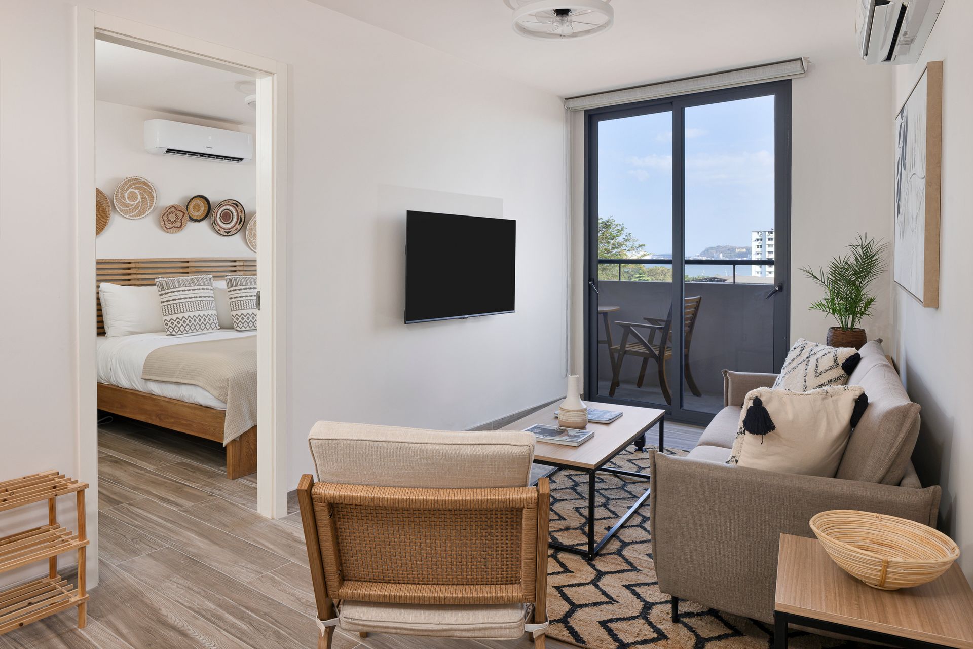 Industrial-chic Airbnb loft interior with modern furniture and city views in Casco View, Panama City.