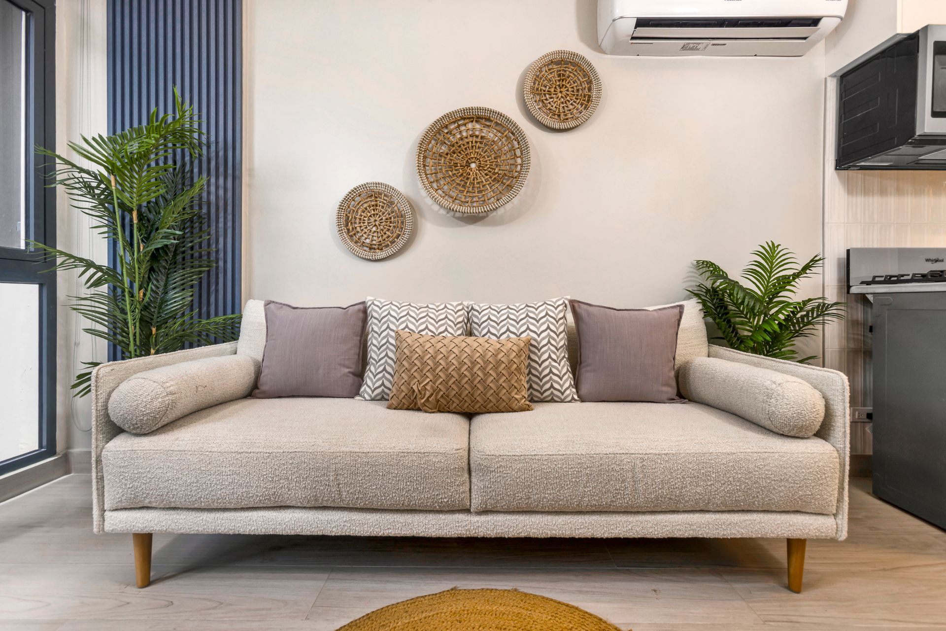 Boutique Airbnb interior design with textured sofa and wall decor in Casco View, Santa Ana, Panama City.