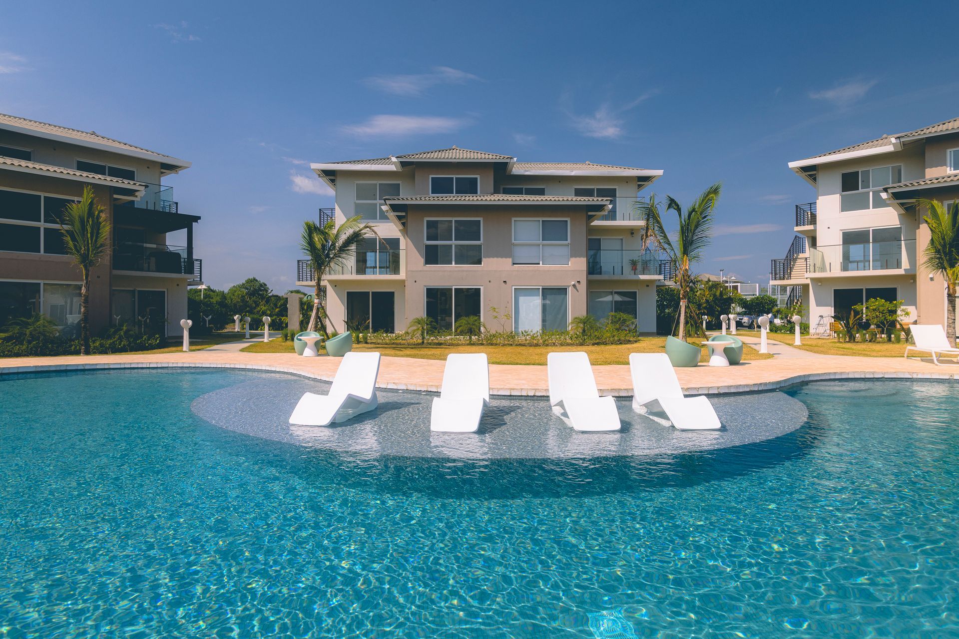 Exterior view of Brisas residential buildings and swimming pool area in Playa Caracol, Panama.
