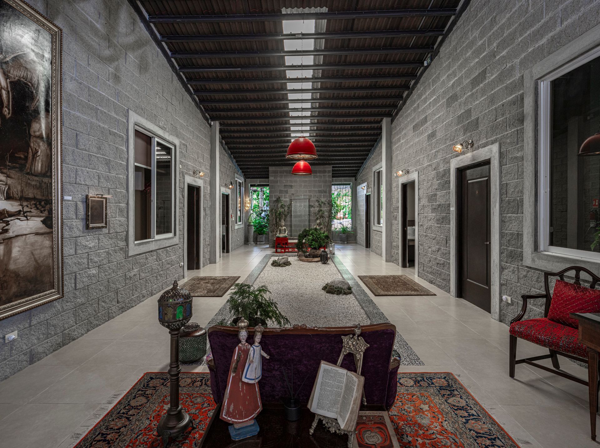 Rustic-luxury eco-suite interior with natural wood walls and a canopy bed at Hotel Madre Tierra, El Valle de Antón.