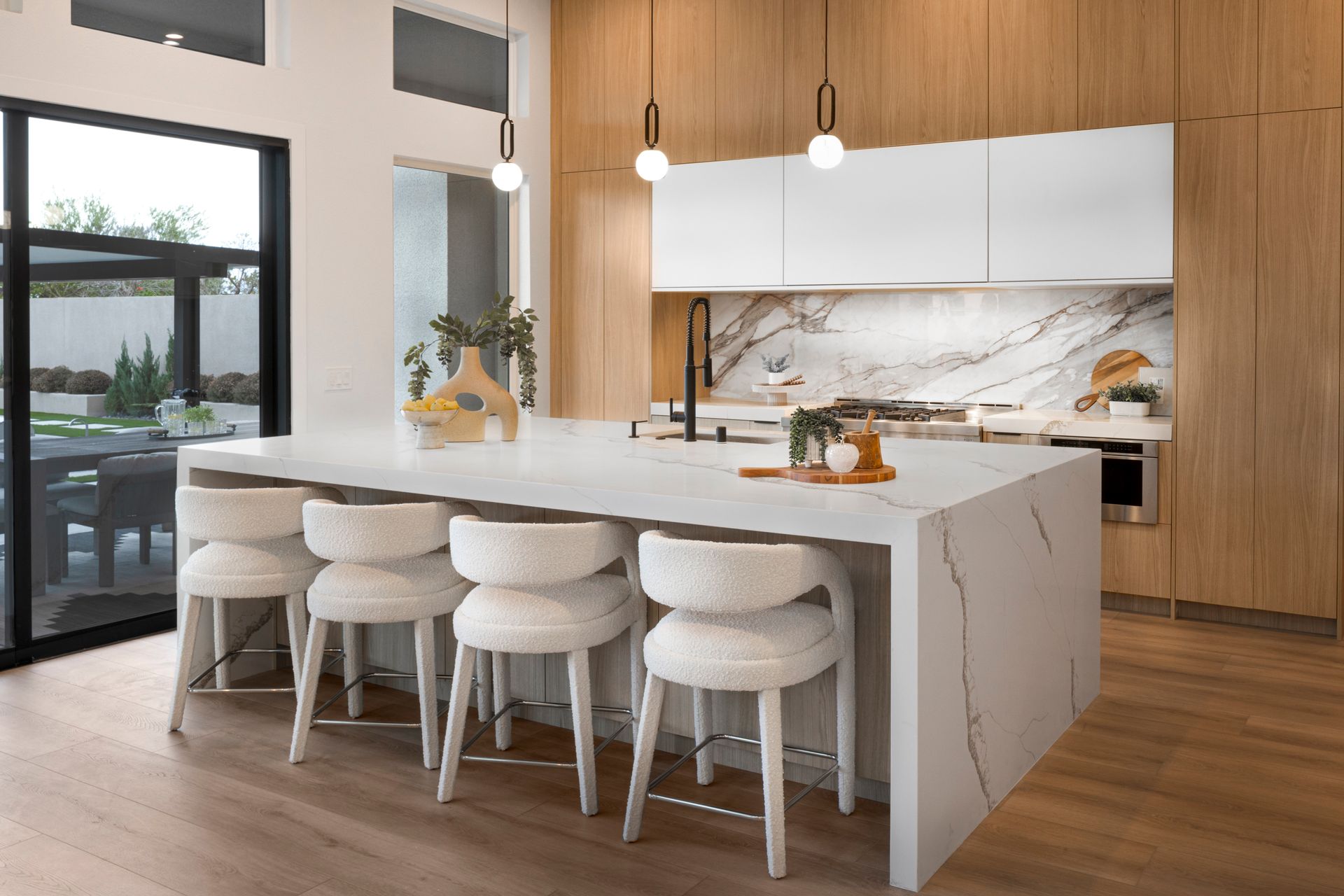 Modern kitchen design with marble island and luxury finishes in an exclusive Las Vegas home.