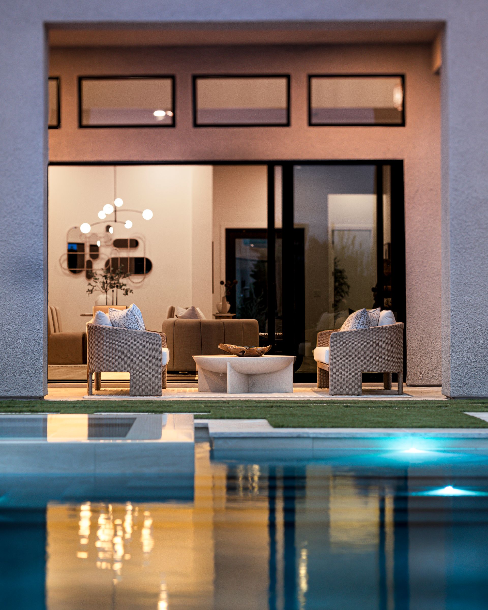 View from the pool into the modern social area of a luxury mansion in Las Vegas, Nevada.