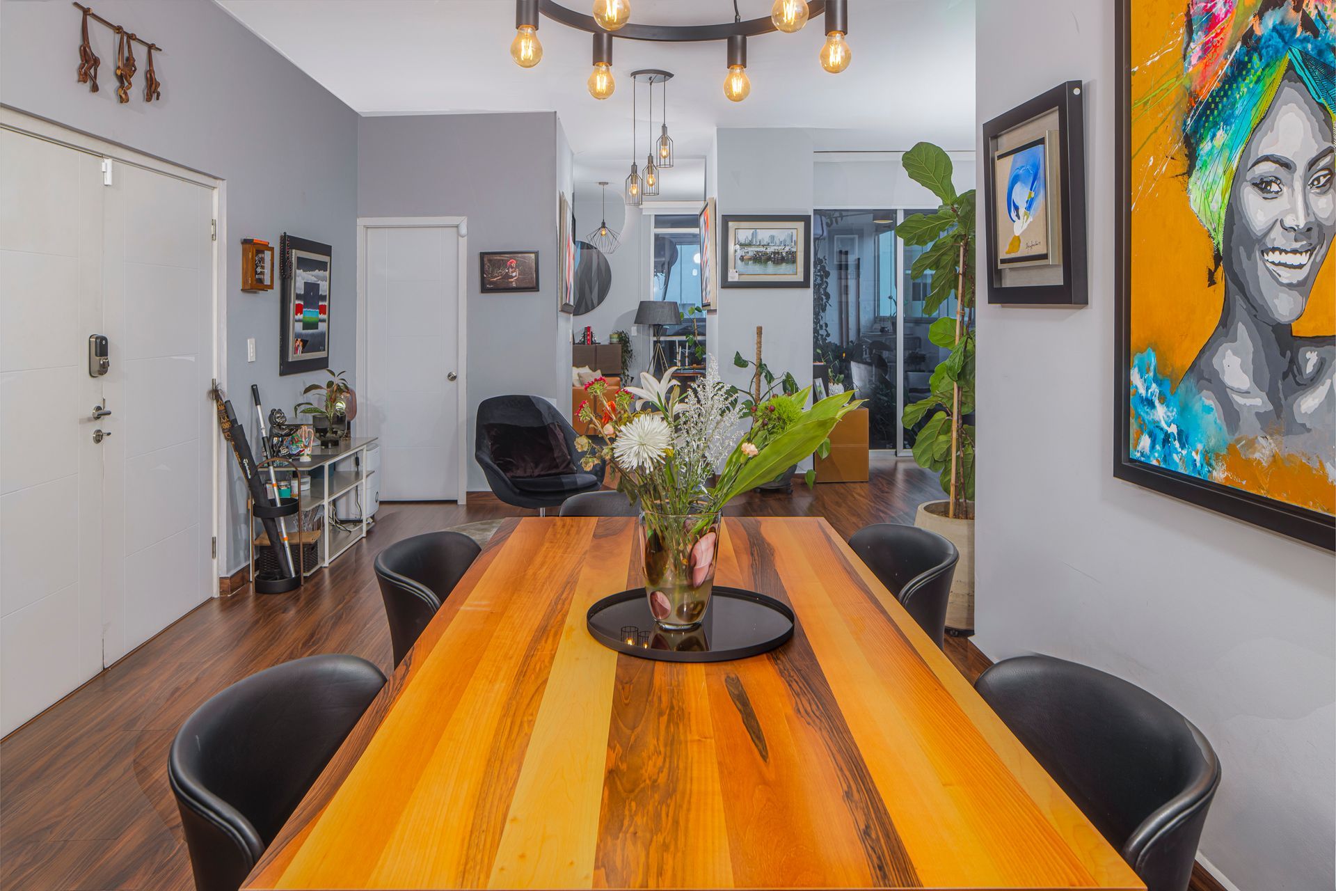Modern living room interior with colorful accents and natural light in an El Cangrejo apartment.