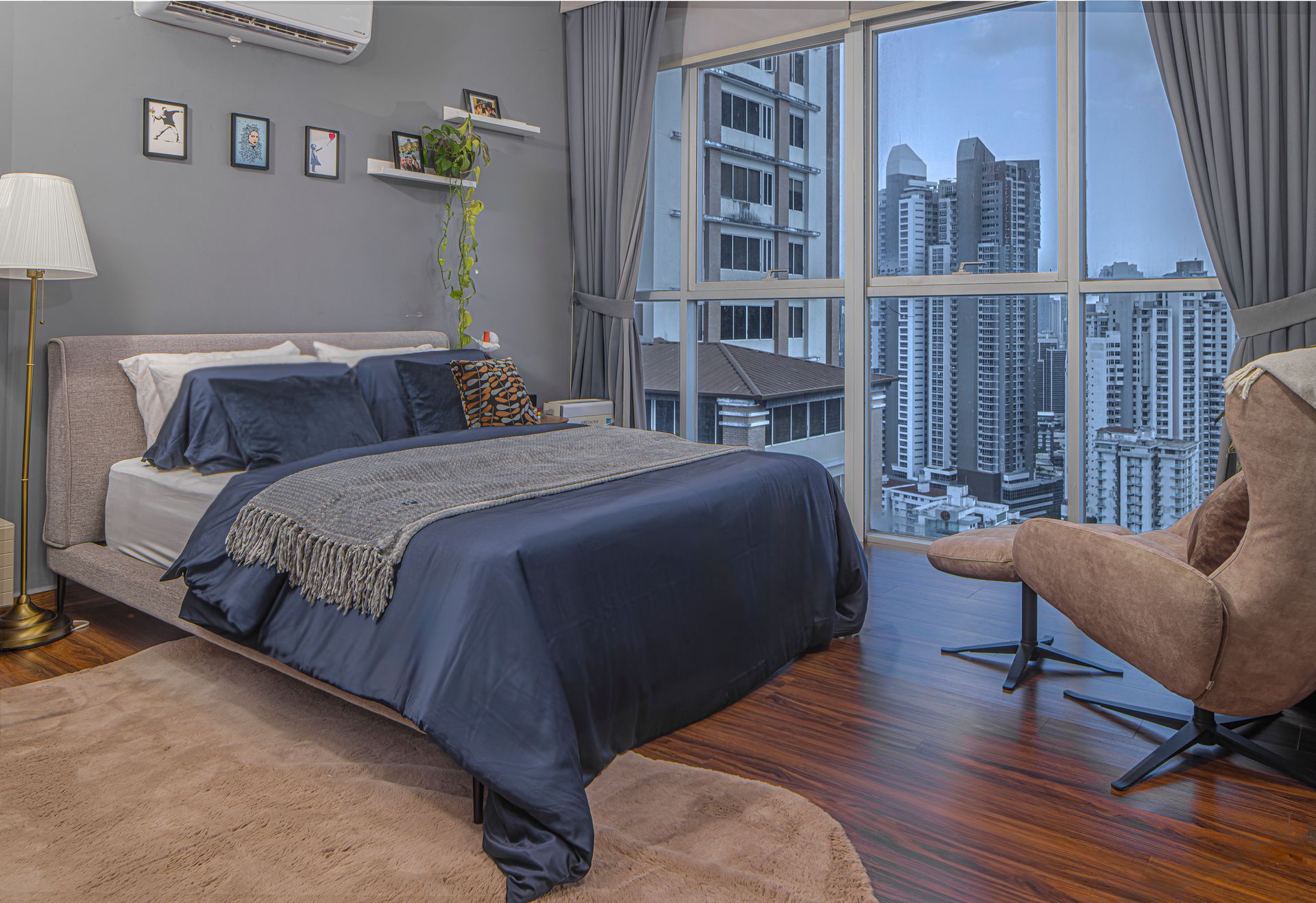 Elegant master bedroom interior with designer wallpaper and modern lighting in El Cangrejo, Panama.